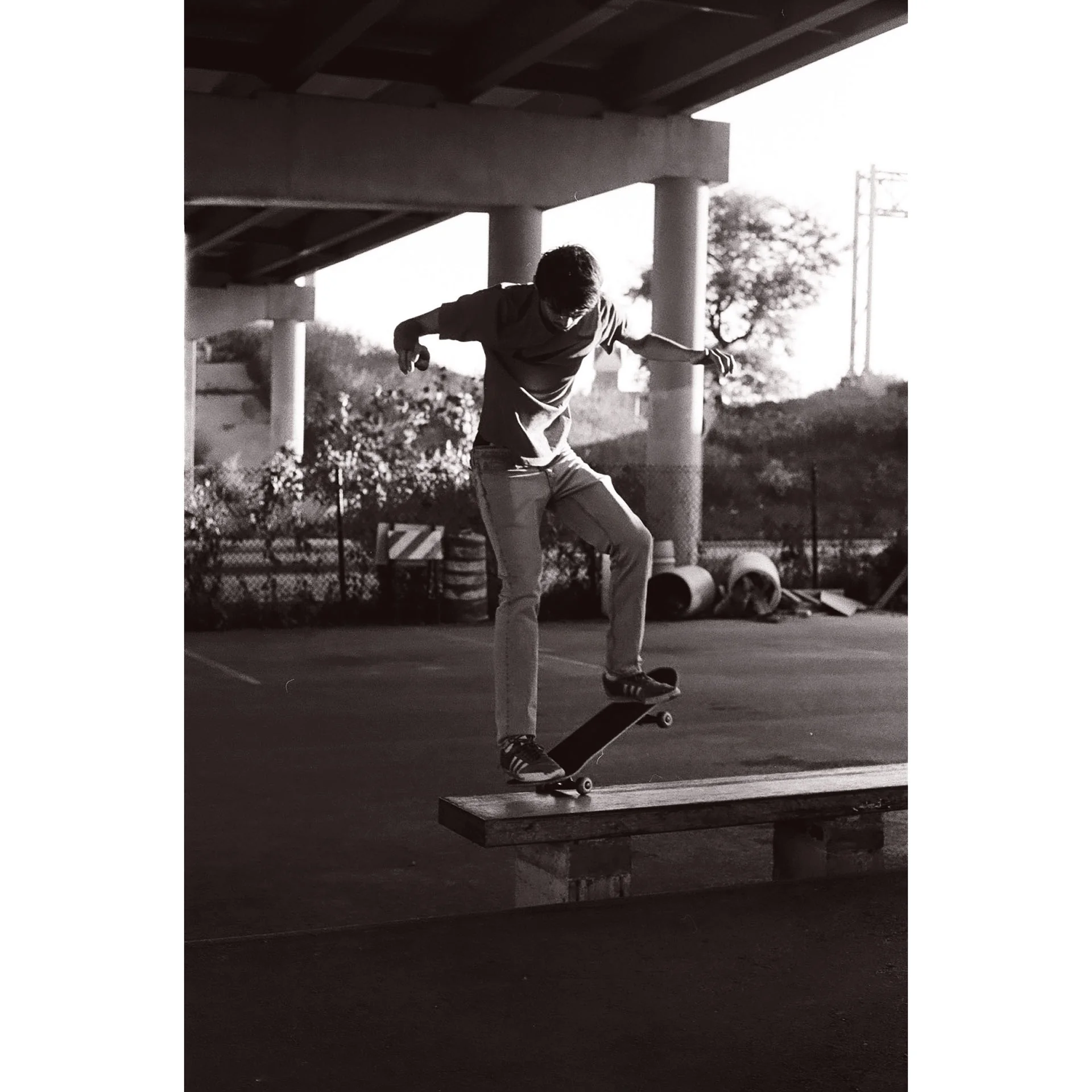 Early black and white film photo taken of a skater doing a nosegrind on a ledge. Photo by Dylan Shanahan.